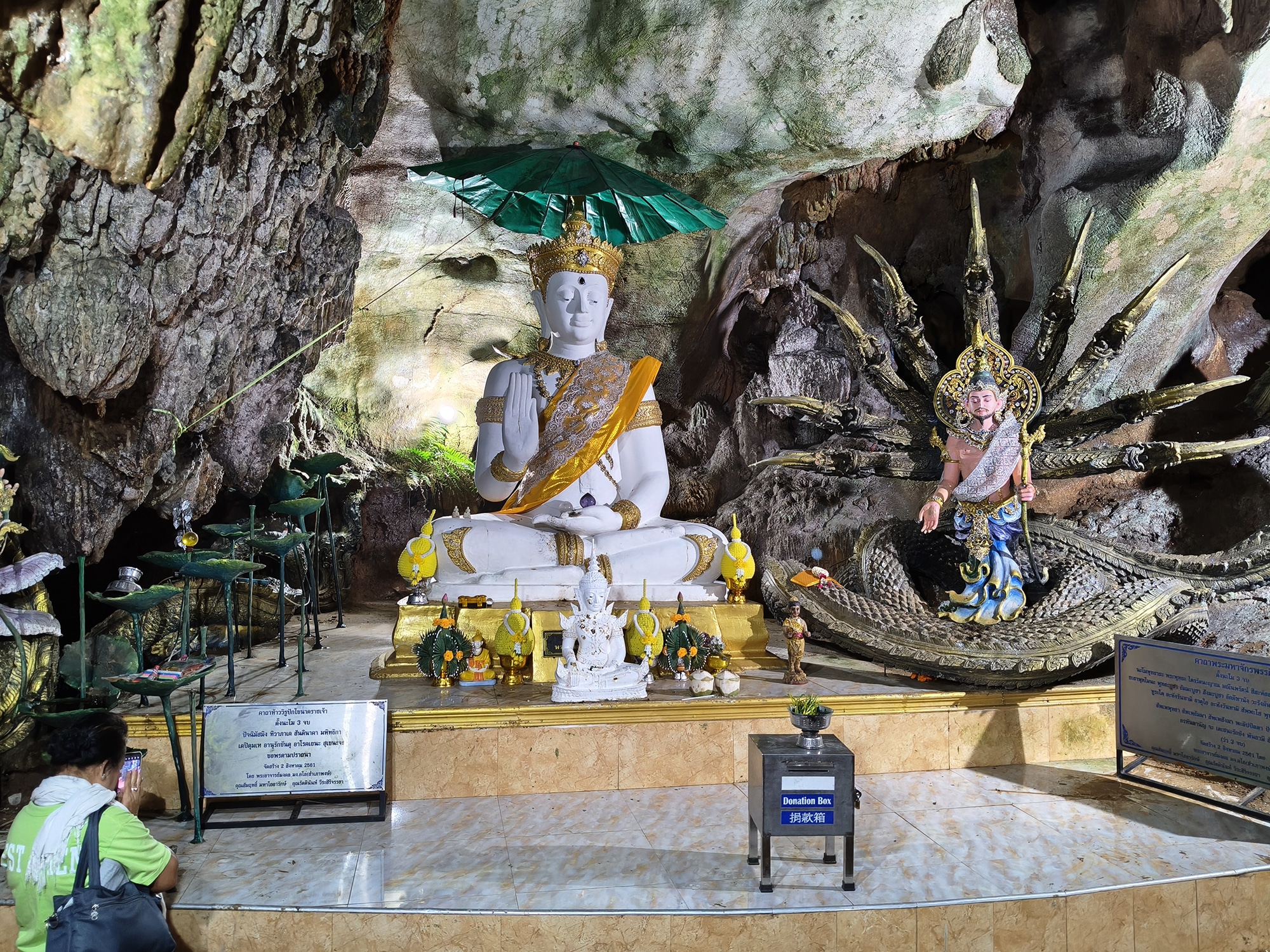 Buddha shrine inside Chiang Dao Cave surrounded by rock formations