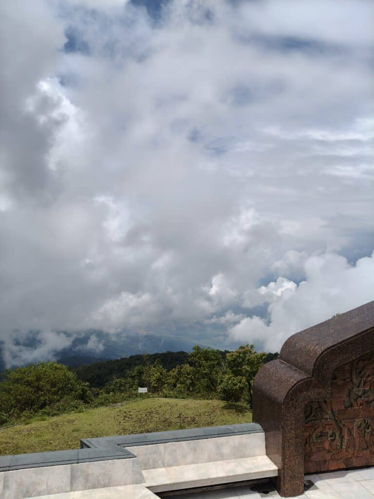 King & Queen Pagodas above the clouds Twin royal pagodas surrounded by colorful gardens and mountain clouds in Doi Inthanon National Park.