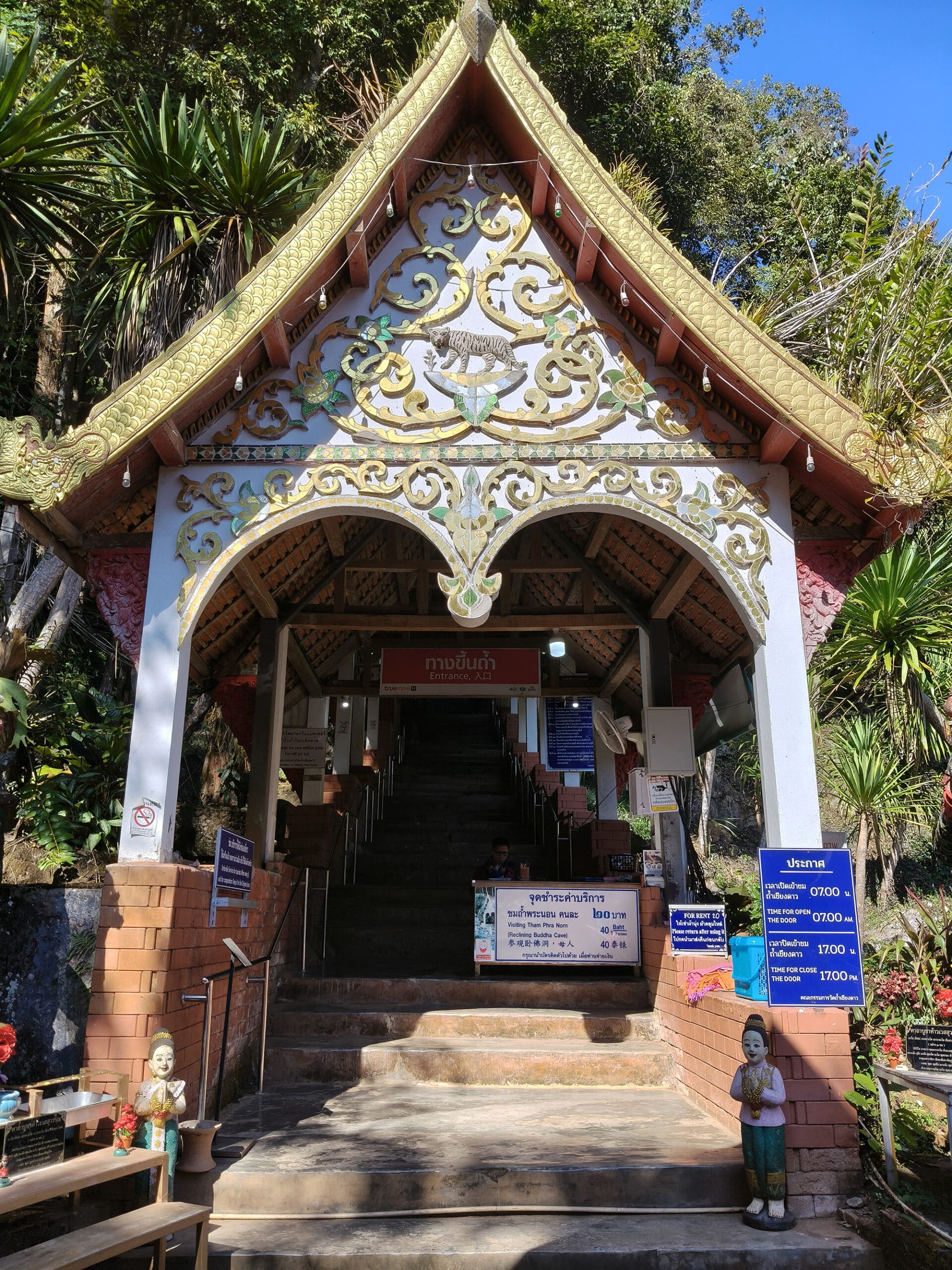 Entrance of Chiang Dao Cave with temple and limestone cliffs in northern Thailand